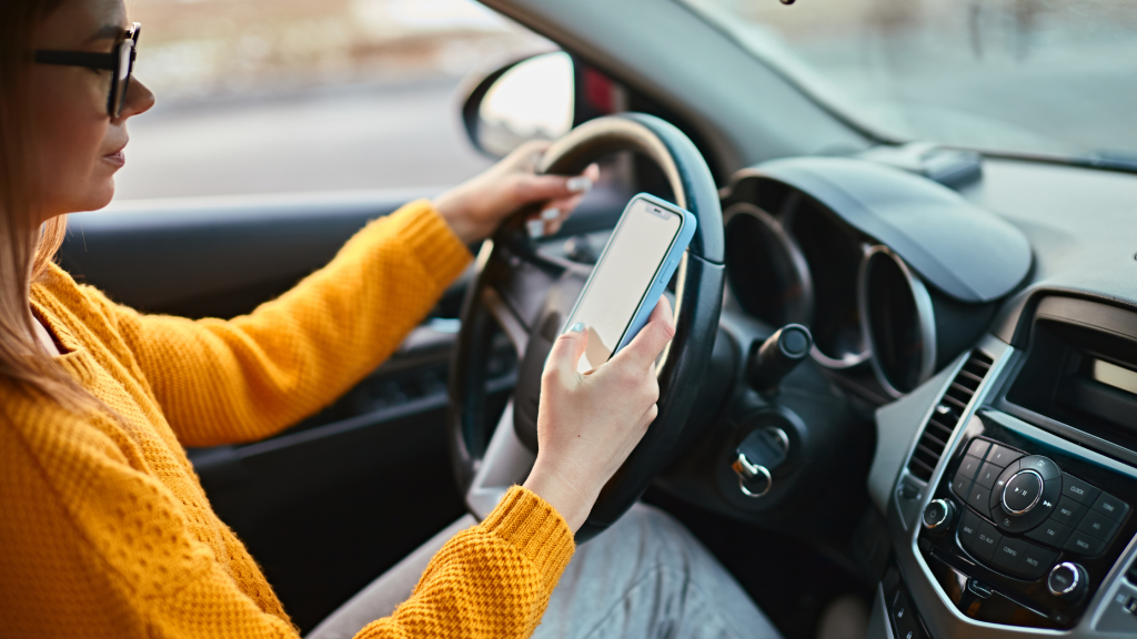 Using your phone while driving | McPartland & Sons Solicitors